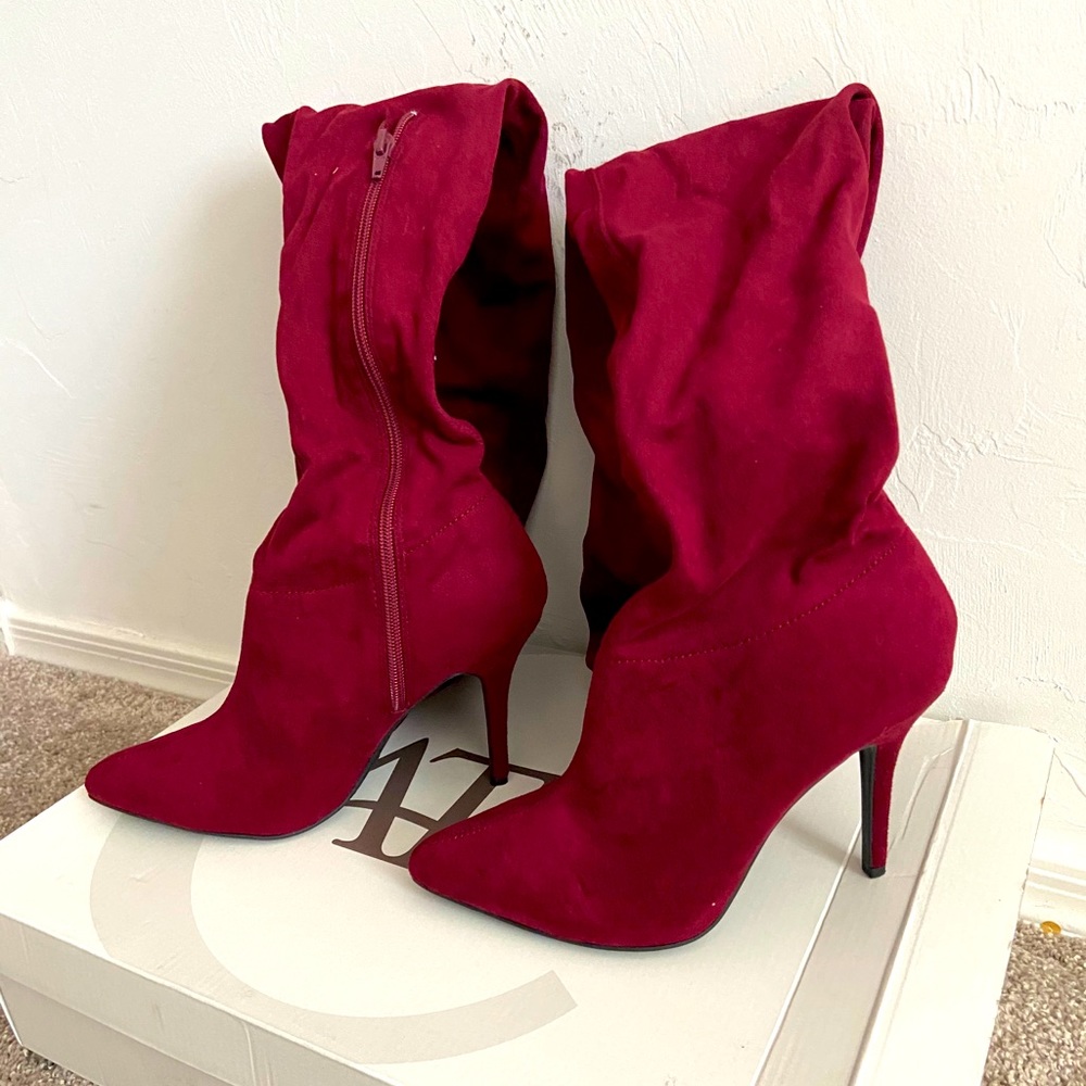 Berry pointed statement thigh high boots.